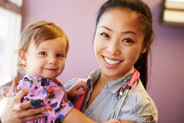 A child is in a health care clinic in this photo. 